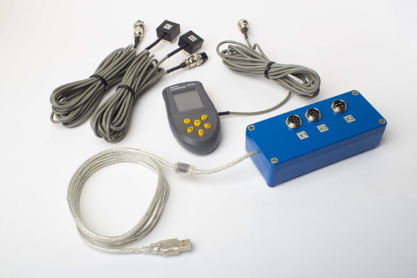 Balanset-1A full kit: measuring unit, two vibration sensors, laser tachometer with magnetic stand, scales, case