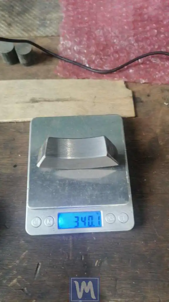 Trial weight placement on a rubberized shaft during lathe balancing