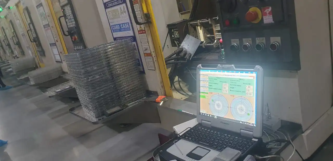 Vibration accelerometer mounted on CNC spindle housing at the front-bearing area for field balancing