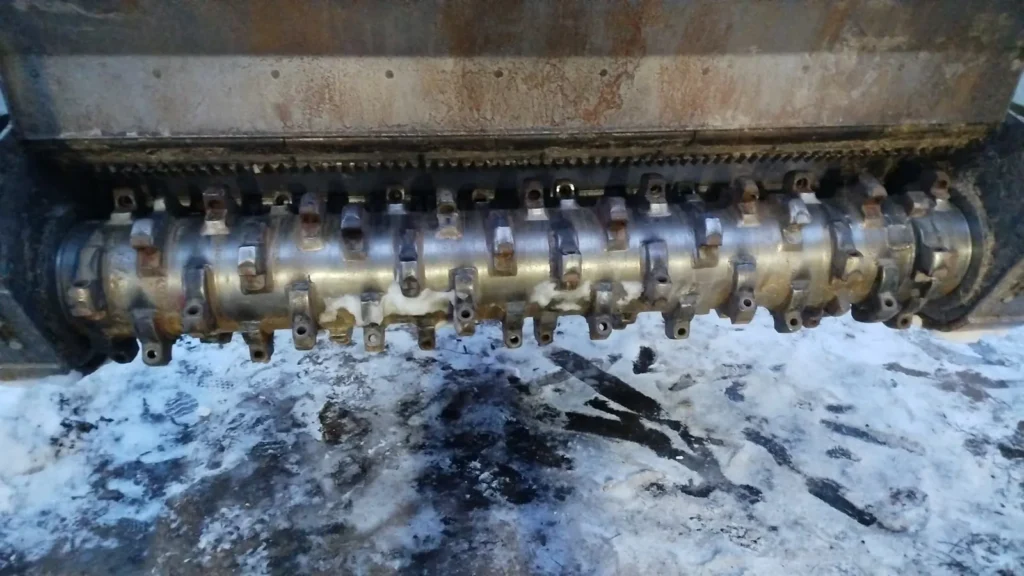 Flail mulcher rotor of about 600 kg with hammers, balanced in its own bearings with Balanset-1A in Poland